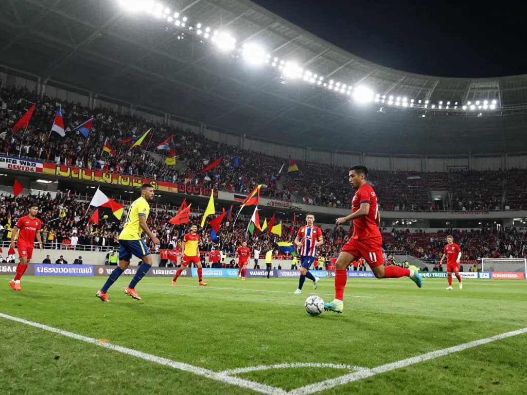 Exciting soccer match scene where fans celebrate γεωργίαผลบอลวันนี้ with intense gameplay on the field.